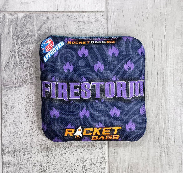 Purple and blue bag with 'Firestorm' and 'Rocket Bags' branding on a light gray background